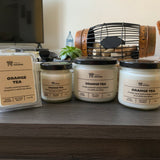 Various sizes of Orange Tea Soy Candles