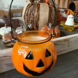 Candle in pumpkin jar